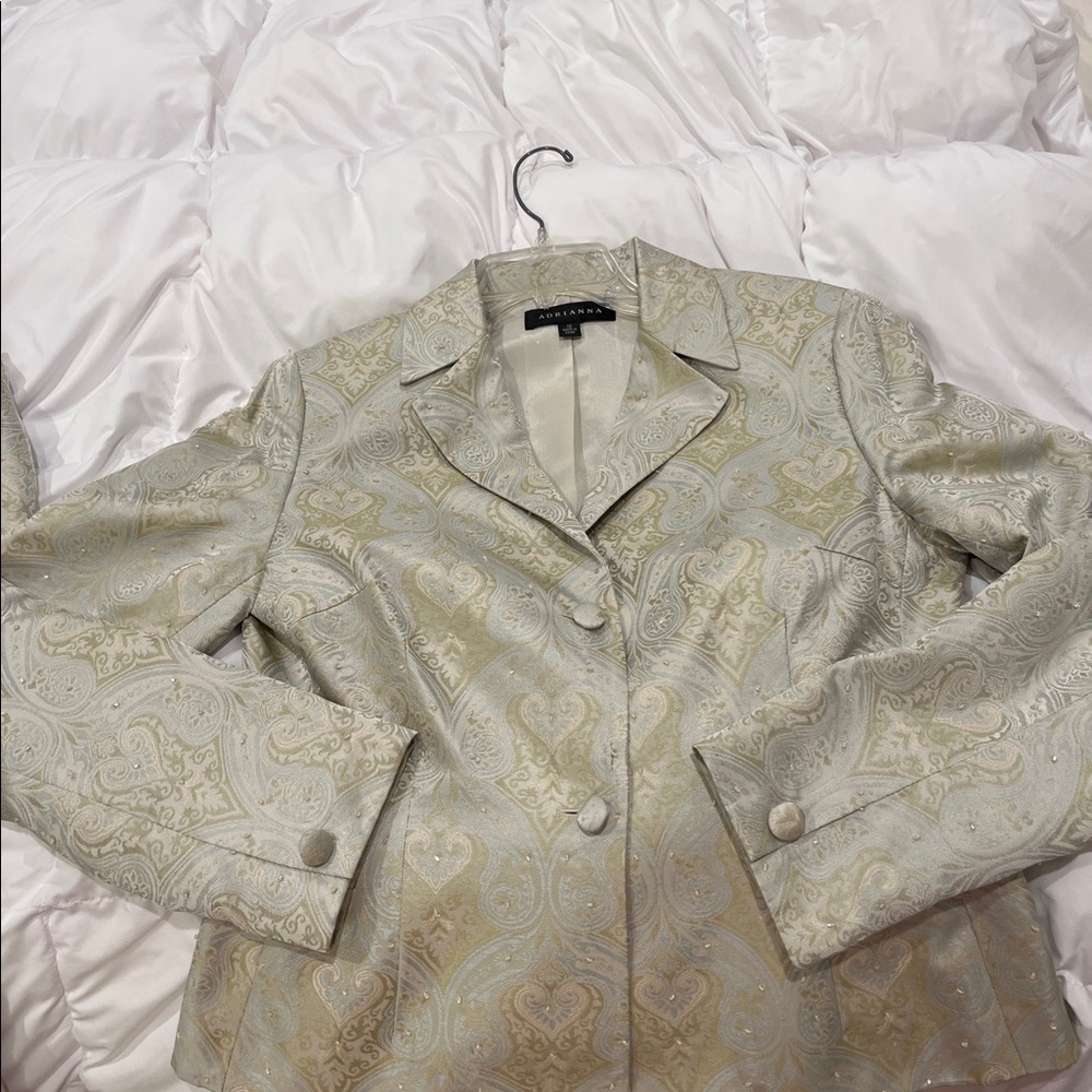 Women a pant suit by Adrianna